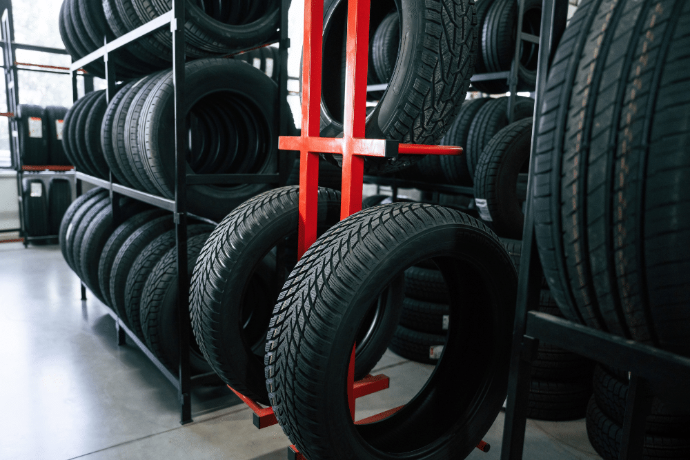 Tire Service in Millersport, OH at Kreager Tire & Service. Image of new tires on display racks for late-summer road trip selection in Millersport, OH